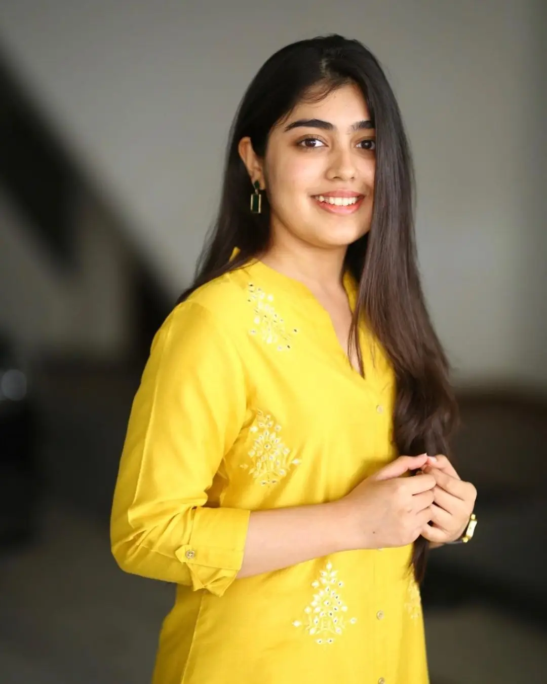 Gargeyi Yellapragada Smiling Face Long Hair Yellow Dress